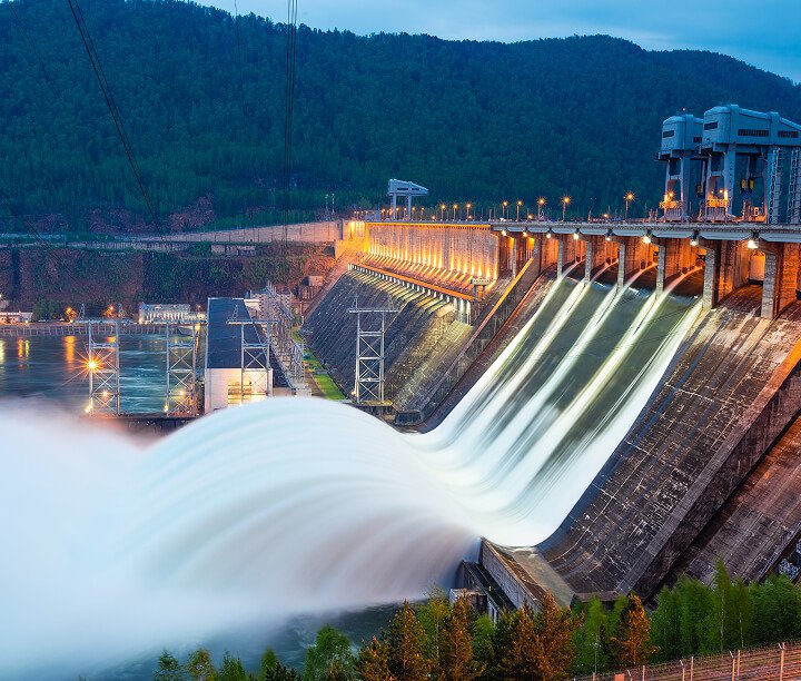 exterior view of hydroelectric power plant with water on spillway